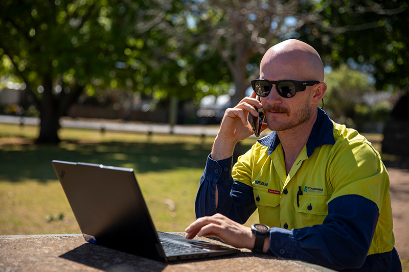 Army veteran Bryan on the phone using a laptop