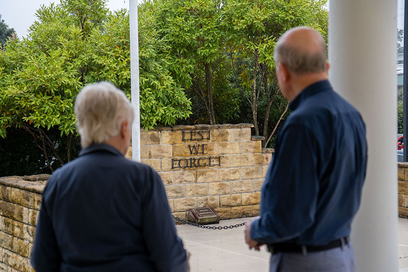 RSL South Eastern District Company Secretary Judy Alterator and RSL South Eastern District President Kerry Gallagher AM looking at a war memorial. 
