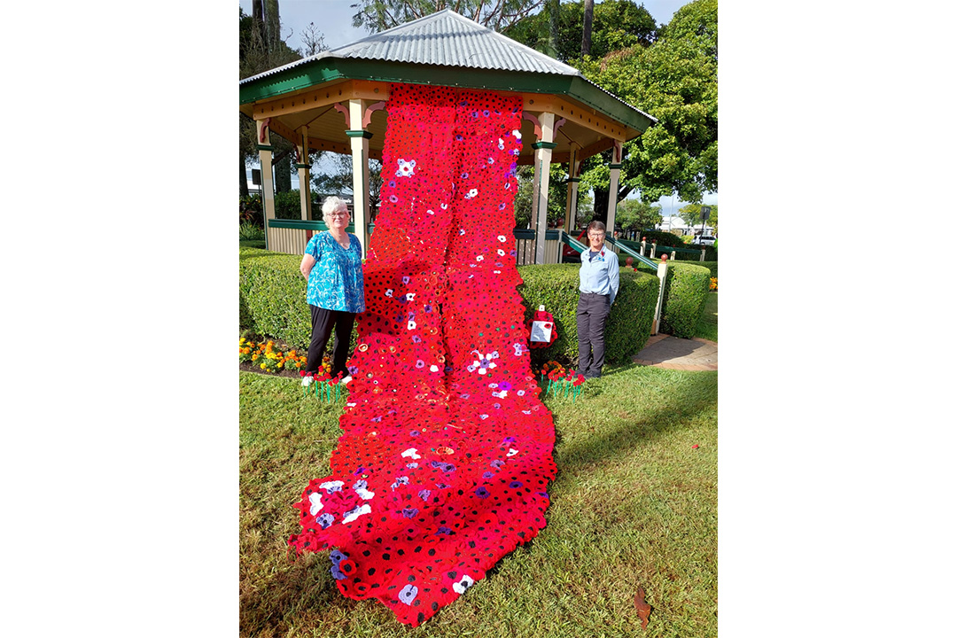 Sandgate QCWA Branch Treasurer Margaret Hay (right) and Vice President and Poppy Project Coordinator Anne Jenkins (left) with the completed display in Sandgate War Memorial Park on ANZAC Day 2025.