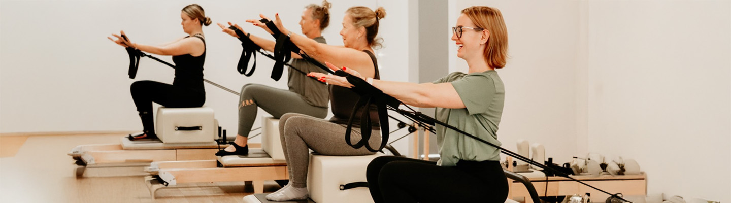 Women in reformer Pilates class