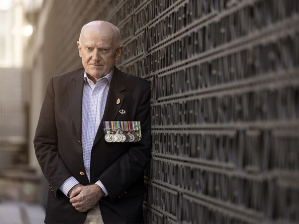 Veteran Kel Ryan standing at ANZAC Square in Brisbane